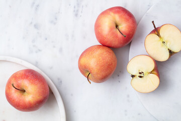 Red delicious apples in a white marble plate. Top view