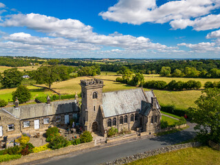 Fototapeta na wymiar Aerial view of church on a sunny day in North Yorkshire countryside