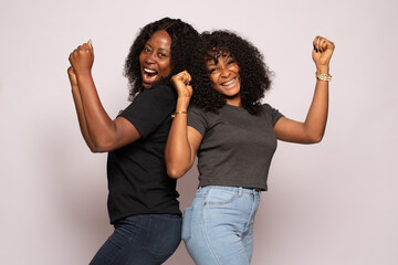two african girls excited and rejoicing