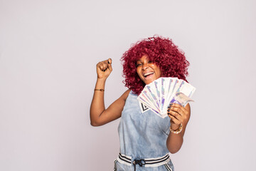 excited and happy african lady flaunting some cash