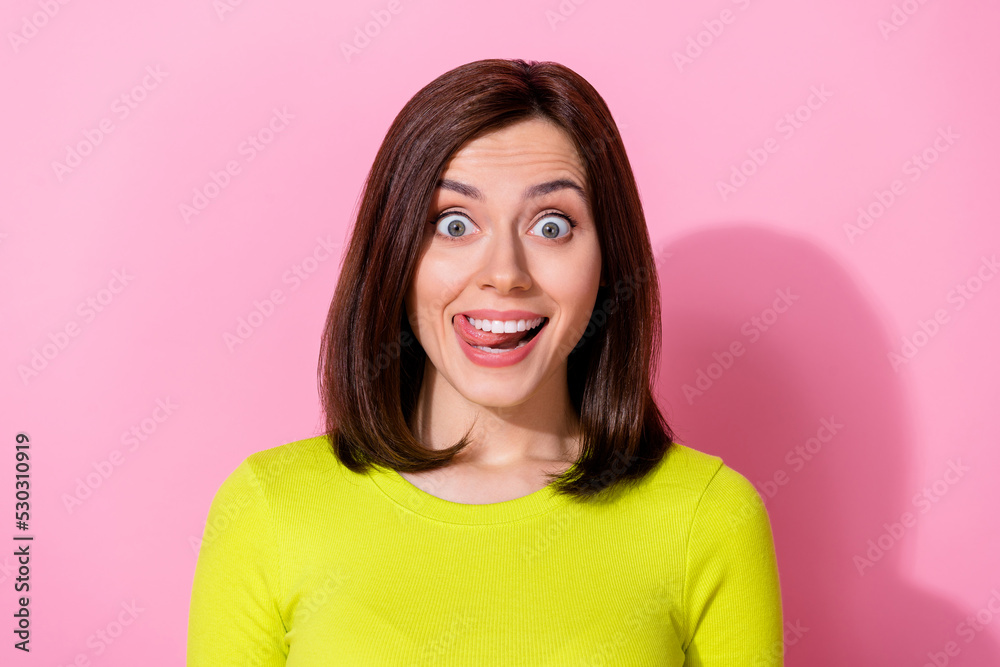 Sticker Photo of astonished positive pretty girl lick teeth beaming smile unbelievable isolated on pink color background