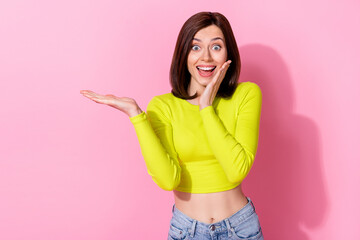 Portrait of crazy impressed lady arm palm touch cheek hold empty space offer isolated on pink color background - obrazy, fototapety, plakaty