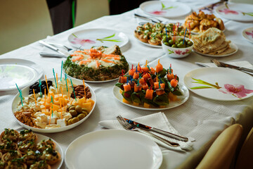 decorated festive table with ready-made dishes