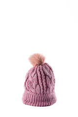 Vertical image of wool beanie with pom pom on white surface