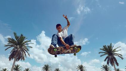 Skateboarder doing a trick in a skate park © Artur Didyk