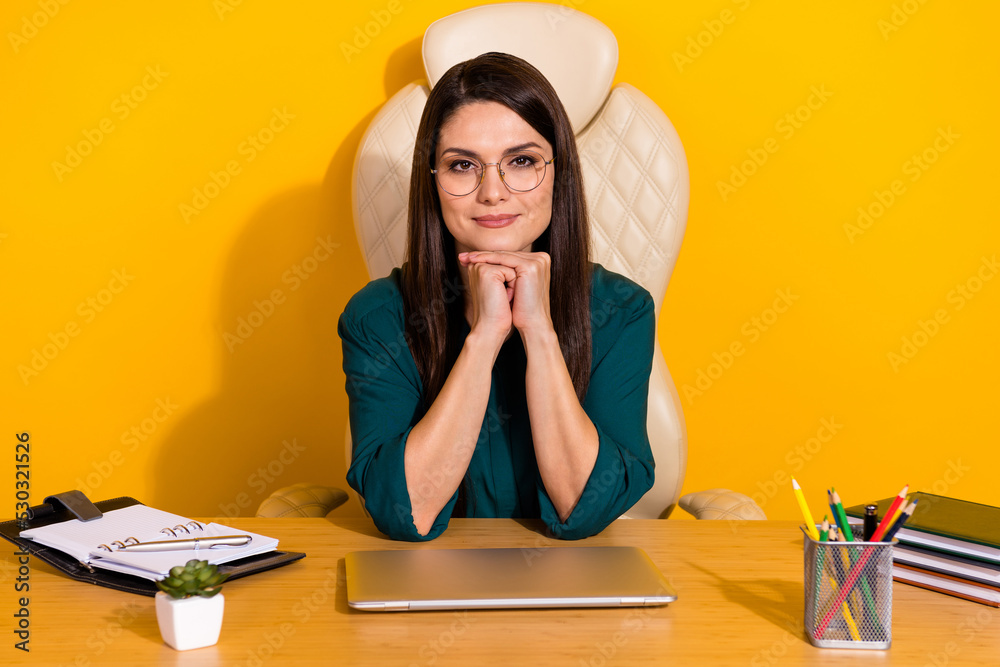 Wall mural Photo of pretty charming lady dressed green shirt glasses working office isolated yellow color background