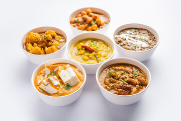 Group of Indian vegetarian dishes, hot and spicy Punjabi cuisine meal assortment in bowls