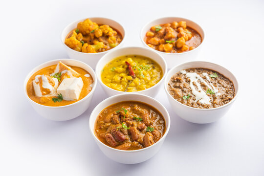 Group of Indian vegetarian dishes, hot and spicy Punjabi cuisine meal assortment in bowls