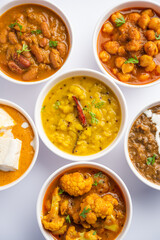 Group of Indian vegetarian dishes, hot and spicy Punjabi cuisine meal assortment in bowls