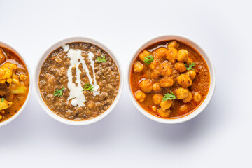 Group of Indian vegetarian dishes, hot and spicy Punjabi cuisine meal assortment in bowls