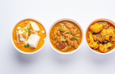 Group of Indian vegetarian dishes, hot and spicy Punjabi cuisine meal assortment in bowls