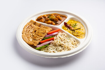 Indian mini meal parcel platter, combo thali with chole Masala, roti, dal tarka, jeera rice, salad