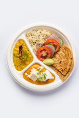 North Indian mini meal, parcel platter or combo thali with paneer butter masala, roti, dal and rice