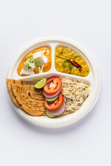 North Indian mini meal, parcel platter or combo thali with paneer butter masala, roti, dal and rice