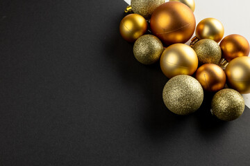 Composition of close up of new years baubles on gray background