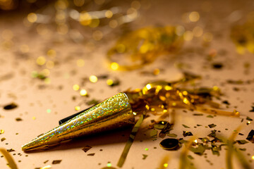 Composition of close up of new years decorations over confetti