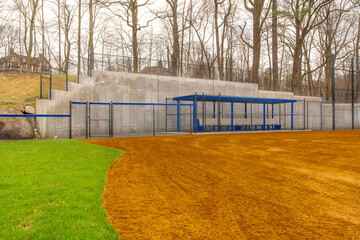 View of typical nondescript high school softball clay infield looking from outfield toward the...