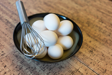 fresh white organic eggs with whisk for omelette