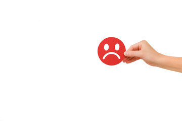Female hand holding red angry face emoticon, isolated on white background with copy space for...