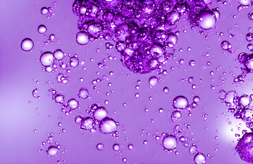 Abstract background and texture of blue bubbles with light illumination. Purple fantasy shapes