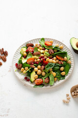 Healthy food vegan avocado salad chick pea on light surface