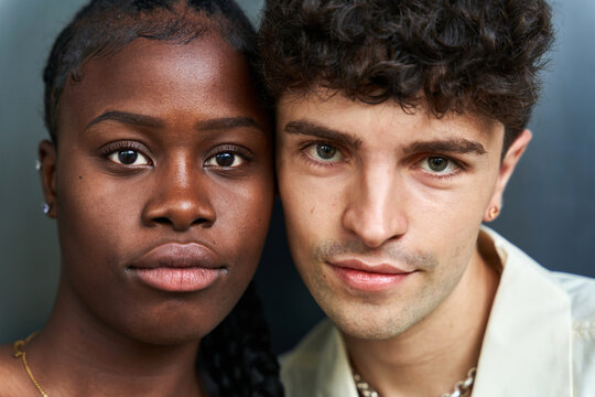 Multiethnic man and woman standing close