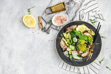 salad with smoked red fish with fresh vegetables, lettuce leaves on a white background, Restaurant menu, dieting, cookbook recipe top view
