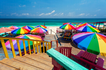 Beach umbrellas in the tropical sunshine Bahamas Caribbean