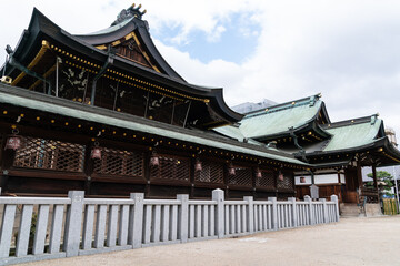 Osaka,Japan - April 15, 2018: magnificent temple buildings with green rooves at Tenmangu Shrine in Osaka japan against blue sunny sky