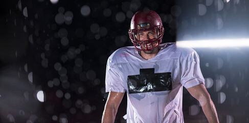 American Football Field: Lonely Athlete Warrior Standing on a Field Holds his Helmet and Ready to...