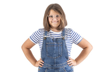 Obraz premium Young brown-haired girl in glasses stands with her hands on hips smiling to the camera