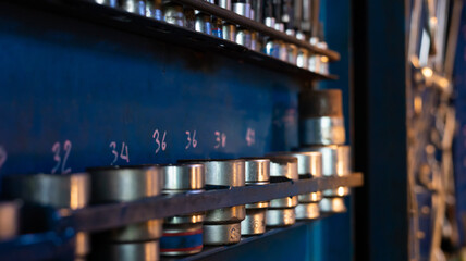 Workshop scene. Tools  and wrenches close-up on the wall board.