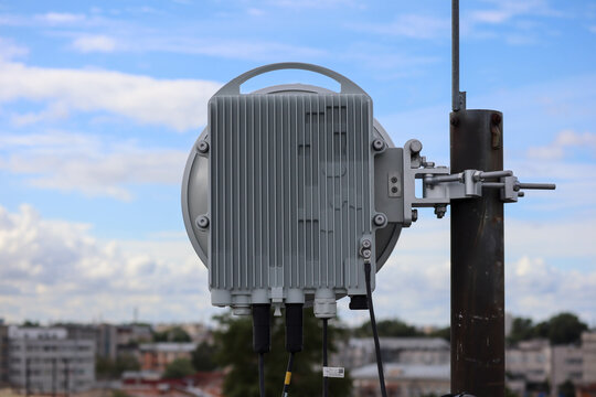 radio relay antenna on the roof with sky on background