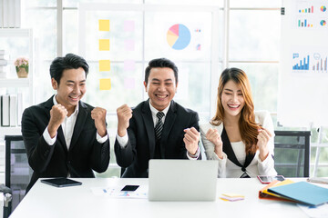 Happy for the success of the professional Asian business adviser meeting to analyze and discuss the strategy of financial support of a tech company. Partnership start-up consultant.