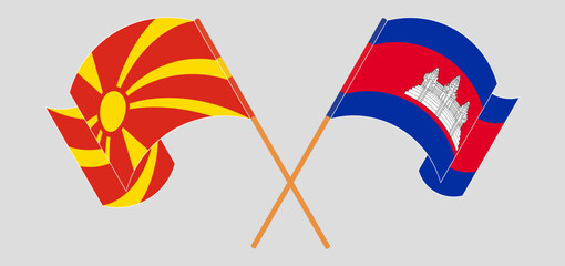 Crossed and waving flags of North Macedonia and Cambodia