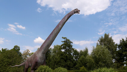 Gigantic herbivorous dinosaur - Brachiosaurus. Dino in the nature.