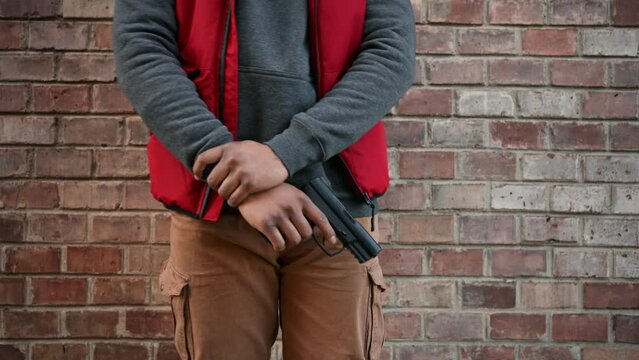 Portrait of young man with a gun.