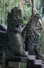 Fototapeta na wymiar Dragon Statues in Bali Monkey Forest - Ubud, Bali, Indonesia