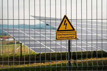 Renewable energy from solar panels in a solar park to generate clean energy.