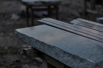 cut sawn granite slabs on workshop table