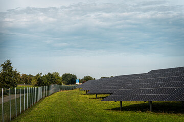 Renewable energy from solar panels in a solar park to generate clean energy.