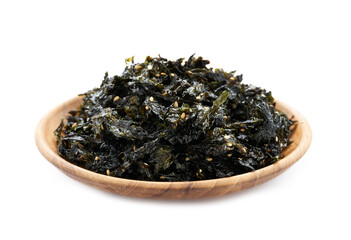 roasted nori seaweed and sesame topping in wood plate isolated on white background. nori laver...