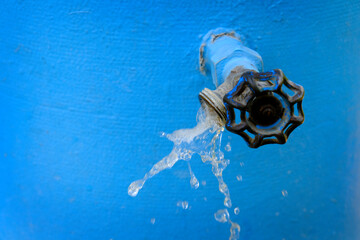 Water Faucet Spraying Water Flow Drops Blue