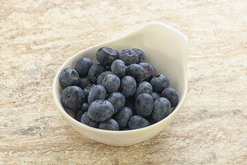 Sweet ripe blueberry heap in the bowl