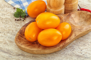 Sweet ripe yellow tomato in the bowl