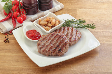 Grilled beef burger cutlet with sauce