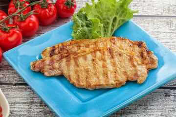 Grilled pork steak with ketchup