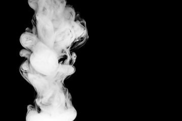puffs of thick smoke against a black background