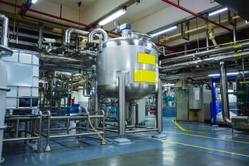 Stainless vertical steel tanks with equipment tank chemical cellar at the with stainless steel...