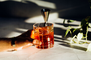 Man hand with a negroni aperitif cocktail